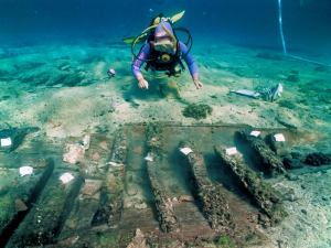 A diver explores the remains of the floor on board the ship 
